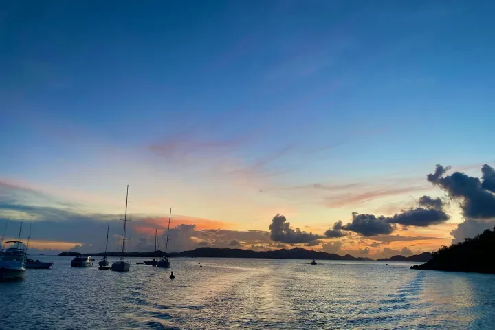 a small boat in a large body of water