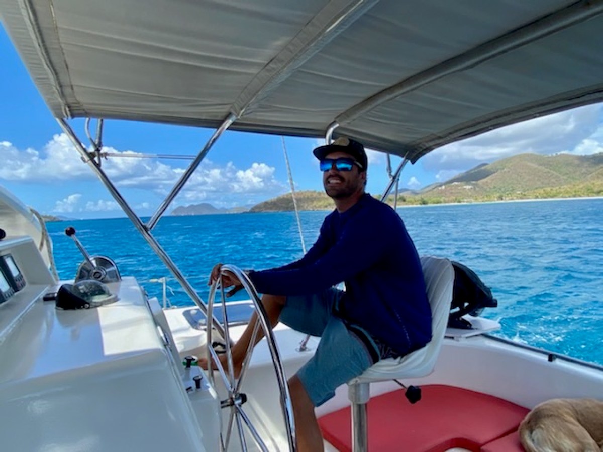 a man sitting in a boat on a body of water